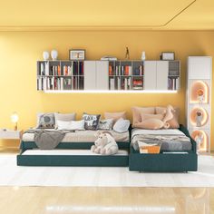 a living room filled with lots of furniture and bookshelves on the wall above