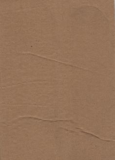 a piece of brown paper that has been cut in half