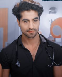 a young man with a stethoscope on his neck and name rohit