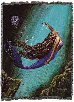 a mermaid with long hair floating in the ocean