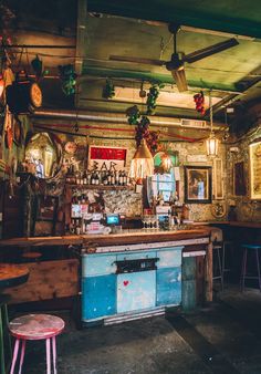 an old fashioned bar with several stools