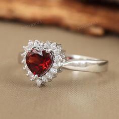 Natural Garnet Sterling Silver Ring-Heart Cut Gemstone Ring-Red Garnet Cluster Ring-Wedding Ring-Statement Ring-Engagement Ring Gift for Her-January Birthstone Ring-Gift for Wife-Red Garnet Silver Ring ★ PRODUCT DETAILS ★ * Product Code - RG-1610-GT * Product - Ring * Metal - Sterling Silver * Metal Purity - 925 * Total Weight - 2.25 GMS (Approx.) ★ STONE DETAILS ★ * Stone Name - Garnet & Cubic Zircon * Stone Shape - Heart & Round * Stone Size - 6mm * Stone Weight - 0.94 CTS * Stone Color - Red Delicate Engagement Ring, January Birthstone Rings, Ring Minimal, Sterling Silver Garnet Ring, Red Garnet Ring, Garnet Ring, Crystal Ring, Forever Love, Red Garnet