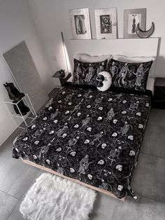 a bed with black and white designs on it