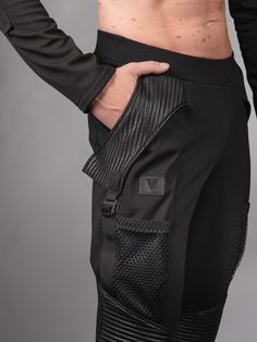 Black joggers are made in textured polyester and viscose fabrics. It's stretchy and allows comfortable wear. The waistband has an opening so you can reach the elastic inside and adjust it with a few stitches. 3 POCKETS - open side pocket, ~28-31 cm deep; - front pocket with Fidlock magnetic closure, ~39-44 cm deep; - mesh pocket for small things.   The way the pockets are made allows extra volume for the pockets without making the pants appear too baggy.    KEY FEATURES - 3 different pockets - N Urban Black Pants With Ribbed Waistband, Stretch Techwear Joggers With Side Pockets, Streetwear Joggers With Elastic Side Panels And Tapered Leg, Streetwear Tapered Leg Joggers With Elastic Panels, Urban Joggers With Ribbed Waistband, Black Stretch Joggers With Elastic Side Panels, Black Tapered Leg Joggers With Elastic Side Panels, Black Joggers With Tapered Leg And Elastic Side Panels, Fitted Bottoms With Ribbed Waistband For Streetwear