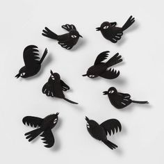 six black birds are arranged in a circle