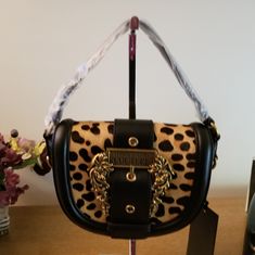 Questions? Leave A Comment Below! Nwt Versace Jeans Couture Pony Leather Crossbody Bag. This Bag Is Beautiful. Comes With Crossbody Strap Still Wrapped With Tissue Paper From The Factory. Designer Bags With Gold-tone Hardware, Designer Brown Shoulder Bag With Metal Hardware, Designer Bags With Metal Hardware, Black Bags With Detachable Handle For Fashion, Black Bag With Gold-tone Hardware, Black Bags With Gold-tone Hardware For Fashion, Designer Top Handle Shoulder Bag With Leather Backing, Designer Shoulder Bag With Top Handle And Leather Backing, Versace Bags