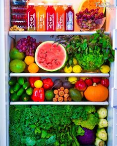 an open refrigerator filled with lots of fresh fruits and vegetables