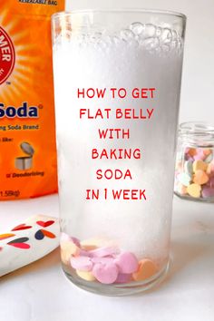 a glass filled with baking soda next to a bag of candy