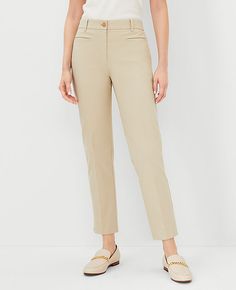 Elevate your wardrobe with the sophisticated charm of Ann Taylor's Cotton Crop Pant in Soft Khaki. These tailored and fitted pants are designed to flatter with a slim leg that's slightly cropped just above the ankle, creating perfect proportions for any occasion. 

- Size: 14 Regular
- Color: Soft Khaki
- Material: 97% Cotton, 3% Spandex
- Gender: Female
- Fit: Tailored and fitted
- Rise: Mid-rise, sits 2 1/4" below natural waist
- Length: Hits above the ankle; 26" inseam with 14 1/2" leg openin Casual Tailored Cropped Leg Pants, Casual Tailored Cropped Pants, Tailored Cropped Leg Bottoms With Pockets, Tailored Bottoms With Pockets And Cropped Leg, Cropped Leg Dress Pants For Spring, Cropped Leg Dress Pants With Pockets For Business Casual, Trendy Khaki Ankle-length Pants, Khaki Ankle-length Pants, Chic Khaki Ankle-length Pants