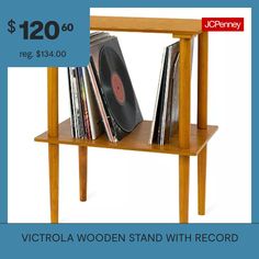 a wooden stand with records on it and $ 120 00 reg $ 43 00 for the record