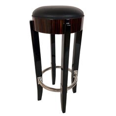 a black stool with a wooden seat and metal barstools on an isolated white background