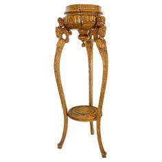 an ornate wooden stand with carvings on it