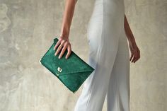 "The perfect bag for all day needs, evening entertainment and going to a party. This adorable bag is handmade out of a beautiful high quality, emerald green suede Italian leather. It is hand stitched with green waxed thread. The color of the waxed thread can change upon request. The interior is fully lined with beige leatherette. The clutch closes with a metal twisted clasp and has metal endings, available in silver and gold color. The pictures show the clutch with gold metal hardware. Dimension Chic Green Pouch Evening Bag, Chic Green Clutch Evening Bag, Chic Green Clutch For Everyday, Chic Green Leather Clutch, Everyday Green Clutch, Elegant Handmade Green Evening Bag, Elegant Green Handmade Evening Bag, Elegant Handmade Green Clutch, Elegant Green Envelope Clutch