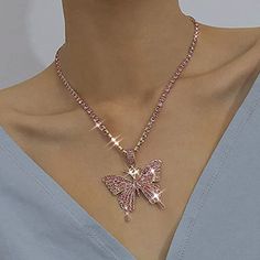 Rhinestone Pendant Necklaces Chain Sparkly Butterfly Short Necklace Is Made Of High Quality Alloy And Rhinestone , It's Strong And Durable ,Doesn't Turn Your Neck Green At All.If You Want To Have A Necklace Suitable For Matching, This Necklace Is Your Ideal Choice Shiny Butterfly Necklace Has 2 Line Extension Chain, You Can Adjust It To Your Own Size So As To Let This Concise Necklace Around Your Neck Perfectly. Package Dimensions : 4 X 3 X 0.1 Inches; 0.35 Ounces Department : Women Asin : B08ld Pink Cubic Zirconia Rhinestone Necklace As Gift, Pink Rhinestone Bling Necklace Gift, Pink Rhinestone Bling Necklace For Gift, Pink Crystal Jewelry With Sparkling Stones, Pink Rhinestone Necklace With Bling For Gift, Pink Rhinestone Clavicle Chain Necklace, Pink Cubic Zirconia Clavicle Necklace, Pink Clavicle Chain Rhinestone Necklace, Pink Rhinestone Jeweled Necklace For Parties