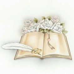 an open book with flowers and a feather resting on it