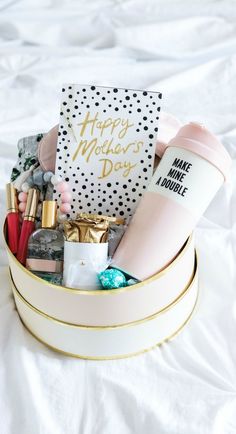 a gift box filled with personal care items and a happy mother's day card