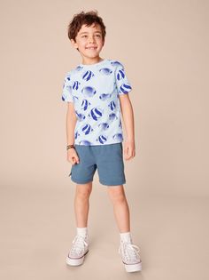 This school of fish is too cool for school--making it the perfect summertime tee. (Fun angelfish fact: Their scientific name means "covered in thorns" since they have a hard, spiny growth for protection.) A customer favorite, our Pocket Tee is a great vacation top paired with chinos or shorts. Crafted from 100% soft cotton jersey. Cotton T-shirt With Shark Design For Summer, Casual Blue Tops With Fish Print, Blue Fish Print Top For Summer, Playful Summer T-shirt For School, Cotton T-shirt For Summer Ocean Activities, Summer Cotton T-shirt For Ocean Activities, Summer Short Sleeve T-shirt With Shark Design, Summer Crew Neck T-shirt With Fish Print, Casual Summer T-shirt With Shark Design