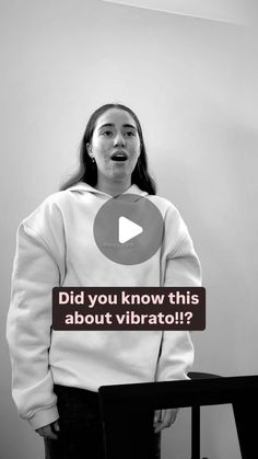 a woman standing in front of a white wall with the words did you know this about vibrato?