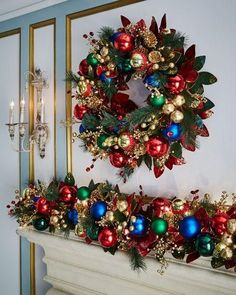 a wreath is hanging on the wall next to a fire place with christmas decorations around it