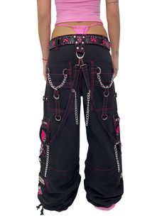 Accept no imitations! From the originator of all things DarkStreet, these black and pink studded pants zip off into shorts (★≧▽^))★☆. They feature two skulls on each leg, removable chains, adjustable ankles, D-rings, and deep pockets. – Drawstring and adjustable waist buckles allow for a tighter fit on the waist. 100% Cotton. Waist measurements are based on the waistband's full extension - that is the maximum inches that the waist will extend to. MODEL IS WEARING X-SMALL SIZE WAIST (Fully Extend Pink And Black Pants, Tripp Shorts, Skull Outfits, Alt Style Outfit, Studded Pants, Skull Pants, Punk Clothing, Alt Style, Skull Clothing