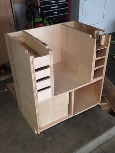 an unfinished cabinet is being built in a garage