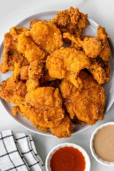 fried chicken on a plate with dipping sauce