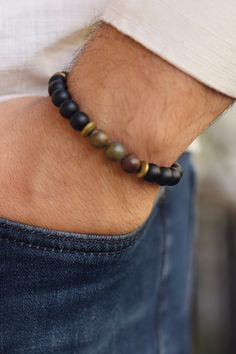 Matte Black Onyx with Jasper Bracelet, Balance Bracelet, Mens Bracelet, Stretch Bracelet, Gemstone Bracelet, Healing Bracelet,Men gifts    Matte Black onyx is a powerful protection stone that absorbs and transforms negative energy, and helps to prevent the drain of personal energy. Black onyx aids the development of emotional and physical strength and stamina, expecially when support is needed during times of stress, confusion or grief.   Sand Jasper is a healing stone full of grounding energy t Black Spiritual Cuff Bracelet As Gift, Spiritual Black Cuff Bracelet As Gift, Spiritual Black Cuff Bracelet For Gift, Black Bracelets With Natural Stones For Everyday, Black Beaded Bracelet With Round Beads, Black Cuff Bracelet With Round Beads For Gift, Black Hand-wrapped Bracelets, Hand-strung Black Bangle Bracelets, Hand-strung Black Bangle Bracelet