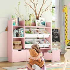 This is definitely what you want for your kids room! This bookcase is compact and offers multiple storage options for children. There are 3 compartments on the left side, suitable for storing and displaying books and toys, and 6 storage boxes on the right side, providing classified storage space. The sliding storage drawer at the bottom makes storage more convenient, fun and easy! Latitude Run® Color: Pink | Latitude Run® Bookcase w / toys Organizer, 3 Removable Drawers 42.1 H x 47.2 W x 11.8 D Toys Organizer, Displaying Books, Youth Furniture, Playroom Storage, Toddler Furniture, Plush Toy Dolls, Toy Organization, Toys Dolls, Crib Sheets