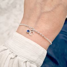 "Sterling silver birthstone and initial bracelet. Our handmade dainty CHLOE bracelet features a sterling silver initial charm with a super cute mini sterling silver birthstone. The bracelet has an extender chain making it adjustable between 6.75\" and 8\" and suitable for most wrist sizes. It comes beautifully presented in one of our foil printed gift boxes with ribbon tie. Components: * Sterling silver chain and fittings * Sterling silver initial - 10mm tall * Sterling silver birthstone - 4mm s Silver Initial Charms, Chain Making, Sterling Silver Initial, Sterling Silver Charm Bracelet, Birthstone Bracelet, Birthstone Gifts, Birthstone Bracelets, Silver Charm Bracelet, Initial Bracelet