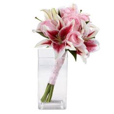 pink and white flowers in a clear vase