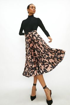 Pretty pleats will never go out of style. Look the part in this gorgeous leopard-print skirt,, which shows off pressed pleats and a swishy, dance floor-ready silhouette. Pleated Satin Skirt, Girls Occasion Dresses, Skirts Pleated, Latest Skirts, Leopard Print Skirt, Black Tie Dress, Party Skirt, Prom Outfits, Puff Sleeve Dresses