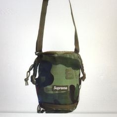 Nwt Brand New Supreme Neck Pouch Fw21 / Woodland Camo / Authentic / Unused, Unopened Item In The Original Packaging / Water Resistance / Camouflage Pattern / Zip Closure Green Bag With Adjustable Strap For Streetwear, Streetwear Bags With Removable Pouch, Streetwear Pouch Bag With Adjustable Strap, Streetwear Bag With Removable Pouch, Casual Pouch Bag For Streetwear, Casual Streetwear Pouch Bag, Functional Pouch Shoulder Bag For Streetwear, Casual Crossbody Zipper Pouch, Functional Camouflage Bags For Everyday Use