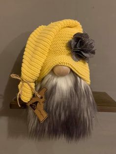 a yellow knitted hat with grey and white hair