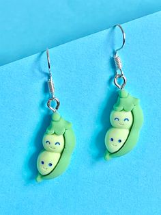 Two Peas in a Pod Cute overload with these peas in a pod dangle earrings, a real conversation opener... quirky, funky, fun and original.  These count as one of your 5 a day If you would like a matching necklace in 925 silver please check out my necklace and earrings section. The hook is made of plated sterling silver to protect your ears and the peas in a pod is made from polymer.  They come well presented and wonderful for a present for a friend, family, your loved one or a treat for yourself. Quirky Hypoallergenic Dangle Earrings, Playful Hypoallergenic Dangle Earrings, Green Novelty Dangle Earrings, Fun Dangle Earrings For Pierced Ears, Fun Green Nickel-free Earrings, Playful Green Earrings With Ear Wire, Green Dangle Earrings With Fun Style, Playful Green Drop Earrings, Green Playful Earrings