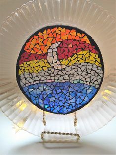 a stained glass plate with a cross on it