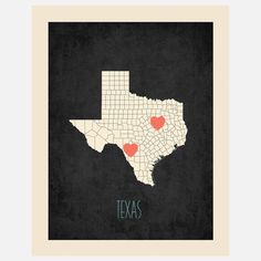 the texas map with hearts on it in black and white, framed by a wooden frame