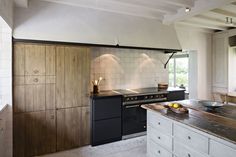 a kitchen with an oven, stove and counter top in it's center island