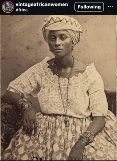 an old photo of a woman wearing a turban