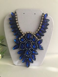 "Beautiful  Royal blue necklace  shine and bright for any special occasional  Necklace statement 5.5\" wide. 8\" height with 30\" extender Closure: ribbon tie Adjustable length  Return & exchanges We gladly accept cancellations Request a cancellation within 4 hour of purchase.  We don't accept return or exchanges but please contact us if You have any questions or any problem with your orders Thank you for shopping with us ♥️ Stay safe & healthy" Royal Blue Necklace, Crystal Statement Necklace, Wedding Accessories Jewelry, Accessories Wedding, Wedding Jewellery Necklace, Necklace Statement, Necklace Blue, Blue Necklace, Ribbon Tie