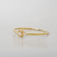 The Venetian Dainty Diamond Ring is handcrafted with tiny natural white diamonds or CZ. Set on 14K gold band in yellow, rose and white gold. 14K solid gold Natural white diamonds or CZ 1.1mm band ** This item is specially made for you. Please allow 1-2 week lead time. Shipping:Domestic: Free standard shipping within the U.S.International: Free standard shipping for orders over $200 Customization:- Interested in customizing this item? See our special order page here to start. - Not sure what your Gold Diamond Ring With Halo Design, Minimalist Gold Diamond Ring With White Topaz, Dainty Diamond Ring In Yellow Gold With White Topaz, Dainty White Topaz Diamond Ring In Yellow Gold, Dainty Yellow Gold Diamond Ring With White Topaz, Dainty 14k Gold Halo Ring, Dainty Yellow Gold Halo Diamond Ring, Dainty Halo Diamond Ring, Dainty 14k Gold Birthstone Ring With Rose Cut Diamonds