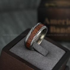 a wooden ring sitting on top of a box