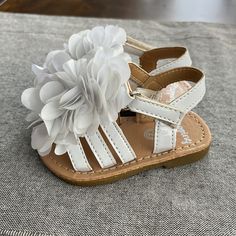 Never Worn! Adorable White Sandal In Size 2. White Adjustable Non-slip Sandals, Adjustable White Sandals For Spring, Cute Open Toe Flip Flops For Spring, Cute Non-slip Flip Flops For Spring, Cute Spring Flip Flops With Open Toe, Spring Non-slip Cute Flip Flops, Cute Spring Open Toe Flip Flops, Spring Cute Non-slip Flip Flops, Playtime Sandals With Soft Sole