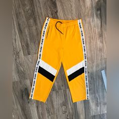 Victoria Secret Pink Athletic Pants Yellow Striped Women's Size Large. Nwt #63 Sporty Yellow Cotton Bottoms, Yellow Stretch Cotton Bottoms, Stretch Yellow Cotton Bottoms, Yellow Stretch Pants With Pockets, Yellow Cotton Stretch Bottoms, Stretch Yellow Pants With Pockets, Yellow Bottoms With Pockets For Loungewear, Yellow Athleisure Bottoms With Pockets, Yellow Loungewear Bottoms With Pockets