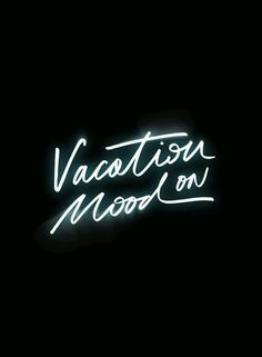 a neon sign that says vacation wood on it