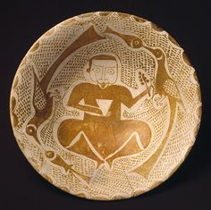 a bowl with an image of a man sitting on it