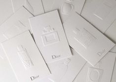 many white cards with different logos on them