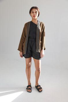 "Linen kimono-style blazer with two patch side pockets. Dropped shoulders and relaxed sleeves make this cardigan democratic for various body types. It goes well with tapered and palazzo pants or even shorts. Great for warm summer evenings. This linen jacket is crafted from exclusive jacquard linen. Its delicate and luxurious lace pattern reminds hand knitted cardigans. The fabric has a really chic look that makes this blazer a perfect pick not only for casual but also more formal occasions. Doub Casual Linen Kimono For Loungewear, Brown Linen Blazer With Pockets, Summer Linen Cardigan For Layering, Brown Relaxed Fit Outerwear For Summer, Summer Linen Long Sleeve Outerwear, Brown Linen Blazer For Fall, Summer Linen Long Sleeve Blazer, Summer Linen Outerwear With Pockets, Casual Linen Blazer For Daywear