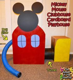 the mickey mouse clubhouse cardboard playhouse is made to look like a barnyard with a blue hose