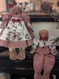 two teddy bears dressed in red and white checkered outfits, standing next to each other