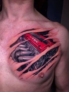 a man's chest with a red car engine tattoo on it, and his arm